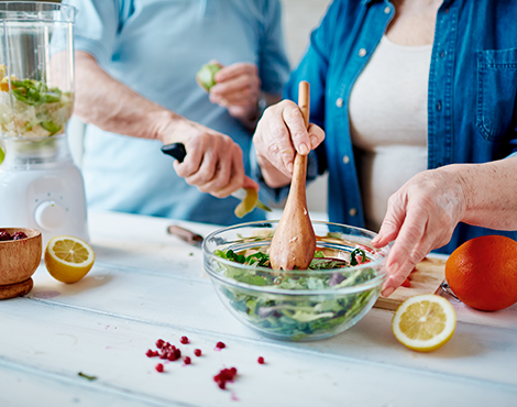 Patient and their spouse preparing a kidney-friendly salad together